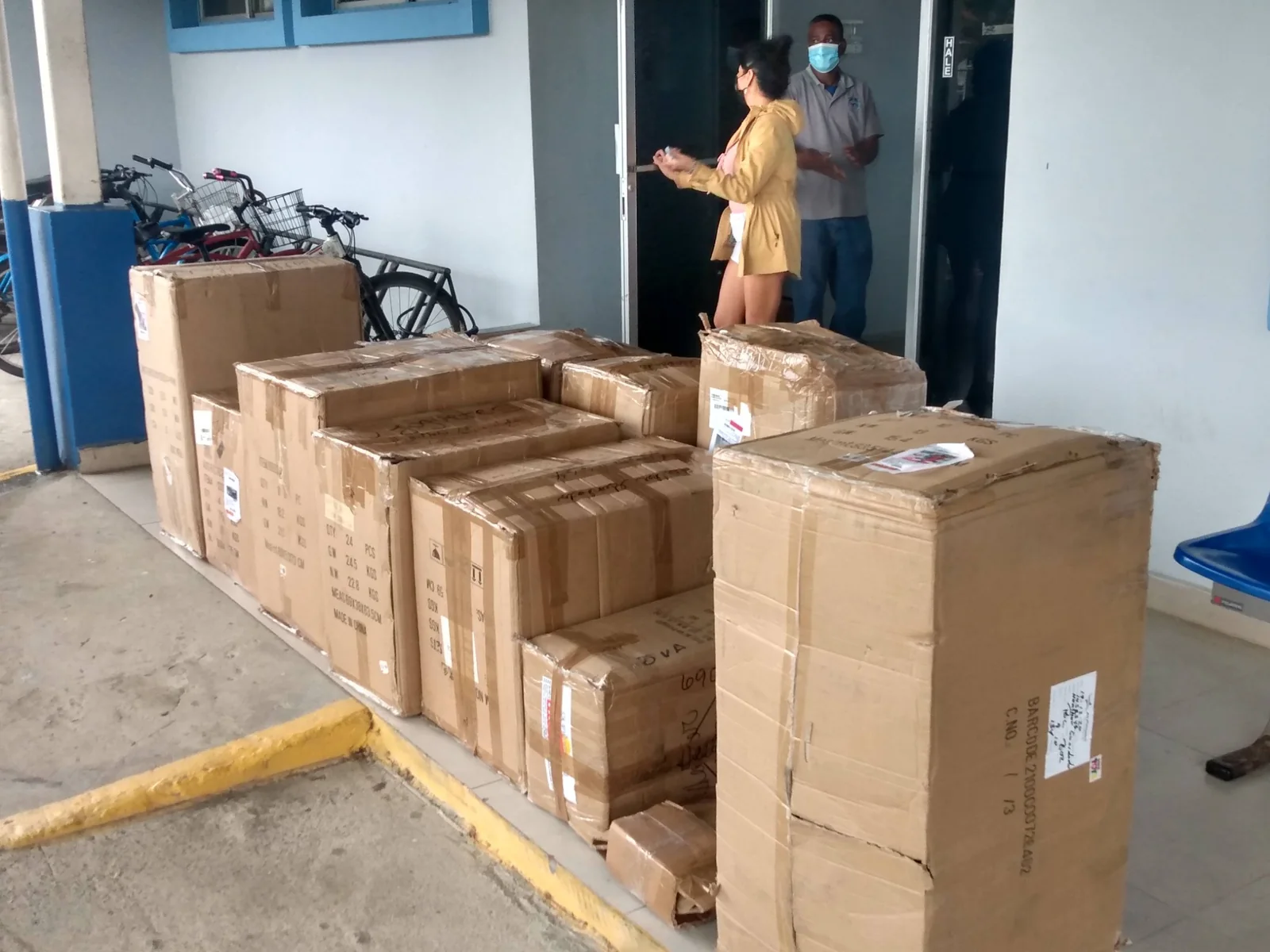 Heather with the Christmas outreach shipment after it arrived at the Bocas del Toro airport