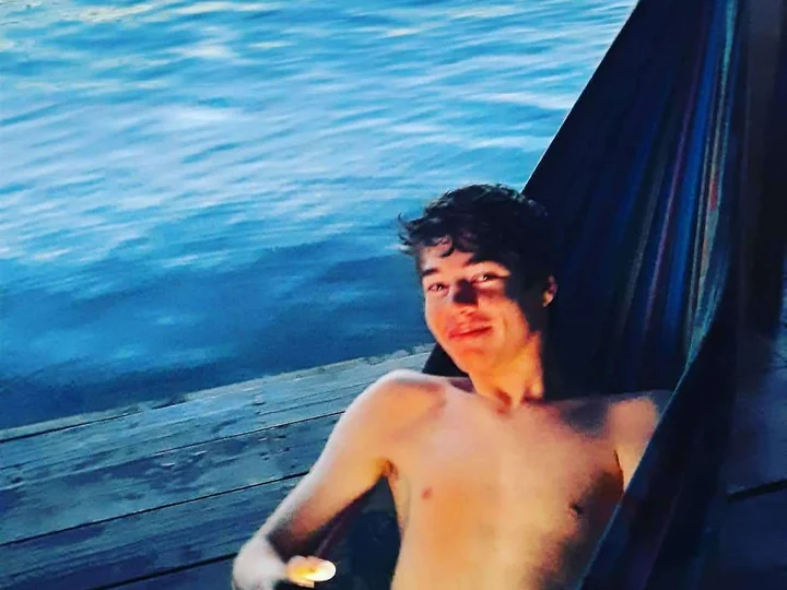 Relaxing in a hammock beside the water in Panama